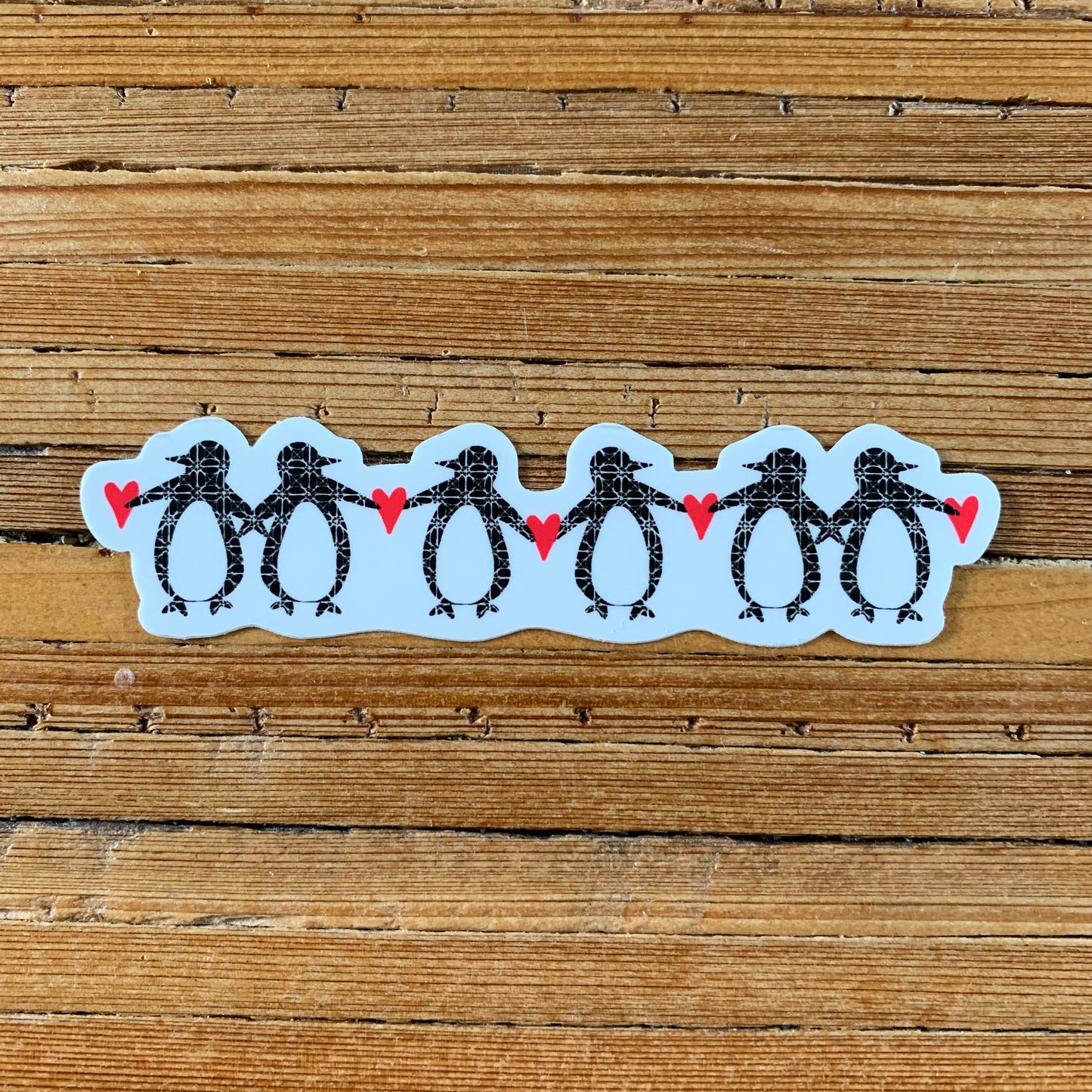 A Row of Penguins Sticker